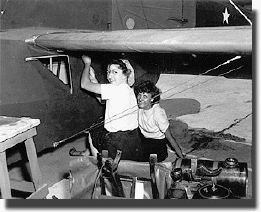   Female workers repair a plane at Morris Field during WWII. Image from the Carolinas Historic Aviation Commission / Charlotte-Mecklenburg Historic Landmarks Commission.