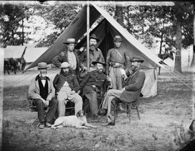 Photograph of General George Stoneman (seated, right) and General Henry M. Naglee (seated, third from left), pose with members of their staffs.
