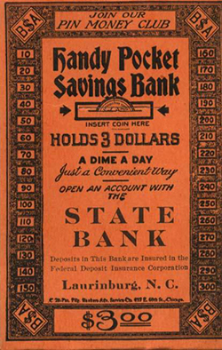 An orange money envelope. Envelope reads "Join our Pin Money club. Handy Pocket Savings Bank. Holds 3 Dollars. A dime a day. Just a Convenient Way. Open An Account with the State Bank. Laurinburg, N.C."