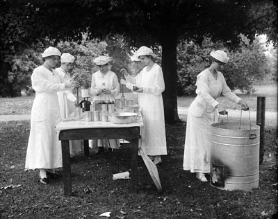Photo of women canning food