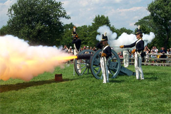 Photograph of re-enactment of firing a Howitzer at Fort McHenry, Baltimore, Maryland. From the Fort McHenry National Monument and Historic Shrine, National Park Service. 