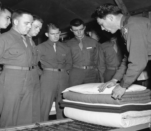 New arrivals at the armys Anti-aircraft Artillery School at Camp Davis learn about vertical bed making and putting bedding on line, or stacking it properly.