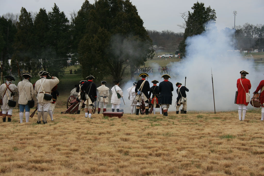 Photographs from a reenactment tell the story of the Battle of Guilford Courthouse.