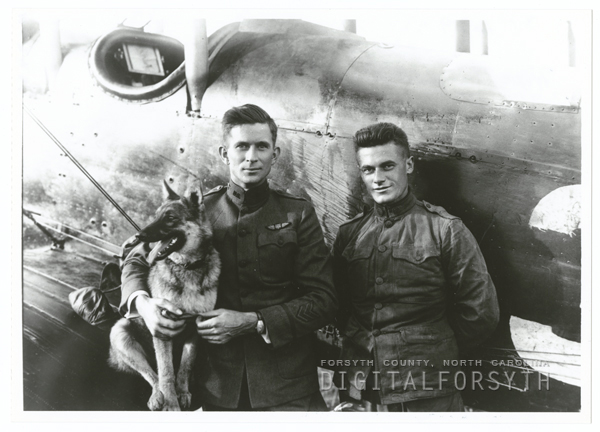 Photo of Maynard Belvin with his dog, Trixie, and mechanic, William Kline