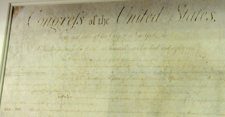 The Bill of Rights. It is a photograph of the original document. Its text is worn and barely legible.