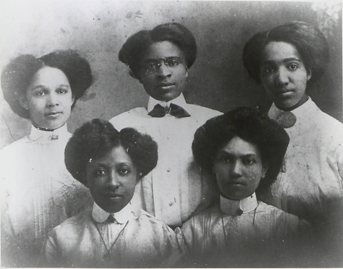 Five Palmer Memorial Institute Teachers. They are black women. Three are in back and two are in front.