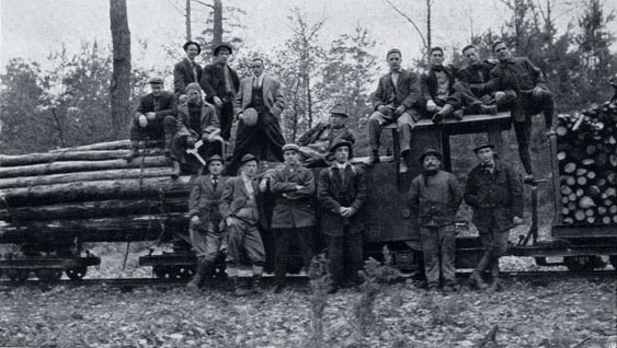 Students from the Biltmore Forest School inspecting a portable forest railroad in Darmstadt, Germany circa 1912.