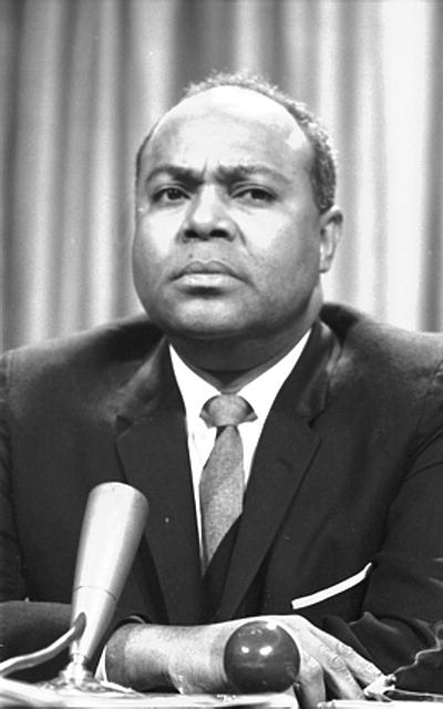 This is a photograph of James Farmer, one of the leaders of the civil rights movement, at a meeting of the American Society of Newspaper Editors in 1964.