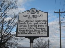 Photograph of the NC Historical Highway Marker dedicated to Pauli Murray. The marker is located in Durham, NC at West Chapel Hill and Carroll Streets, near Murray's childhood home.