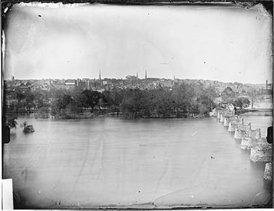 An old black and white photo of North Carolina with many trees and homes