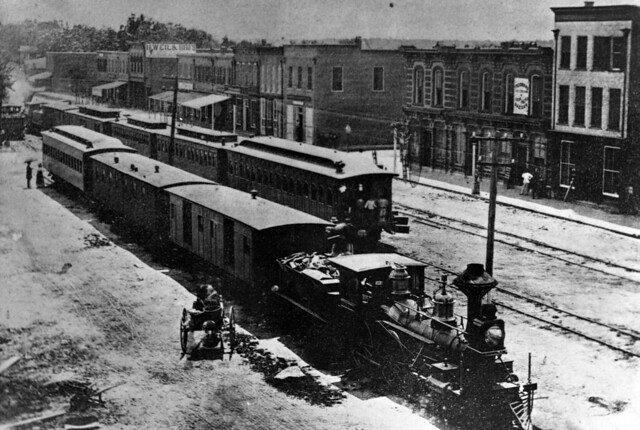 Photograph of Goldsboro, N.C. ca 1870, showing the railroad station and business district on Main Street. Item PhC68_1_34 from Carolina Power and Light (CP&L) Photograph Collection (Ph.C.68), Courtesy of State Archives of North Carolina.