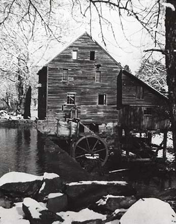 Photograph of Wake County's Yates Mill, ca. 1942. The mill was originally constructed in the 1750s and remained in use until the 1940s. Gristmills were often the center of rural community life. From the collections of the NC Museum of History.
