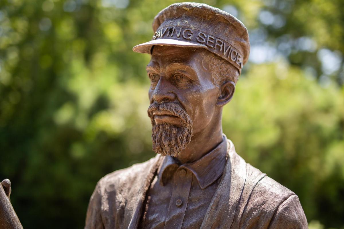 Bronze statue of Richard Etheridge wearing military apparel, with a concerned expression on his face, a medium goatee, and short hair