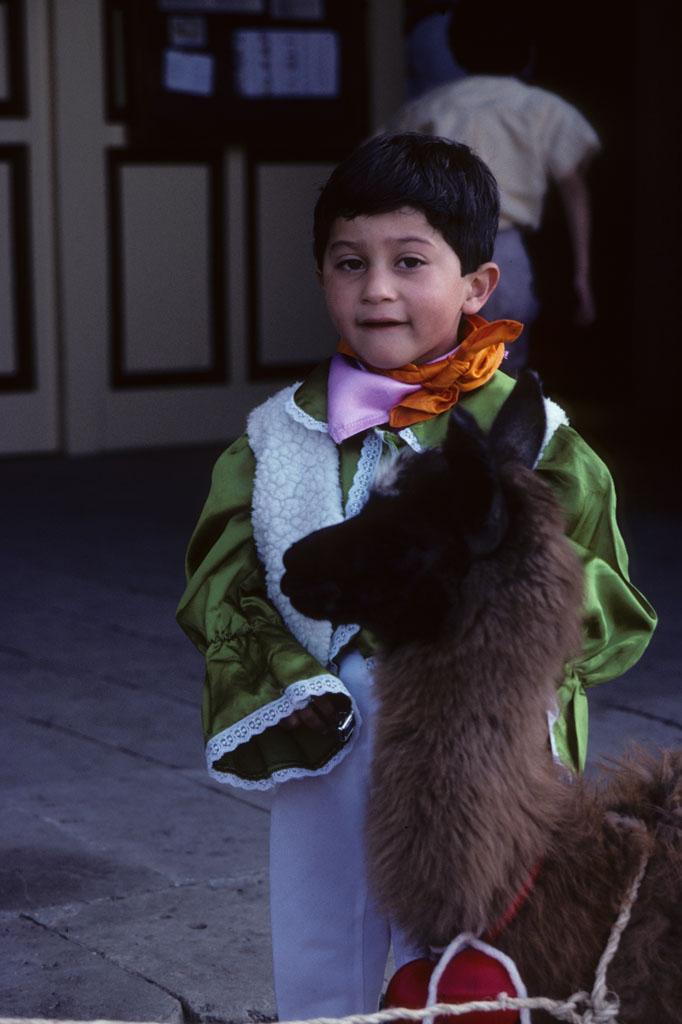 <img typeof="foaf:Image" src="http://statelibrarync.org/learnnc/sites/default/files/images/ecuador_100.jpg" width="682" height="1024" alt="Child with a llama in Riobamba, Ecuador" title="Child with a llama in Riobamba, Ecuador" />