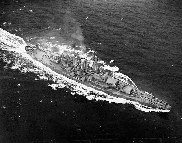 A battleship sails in open water. 