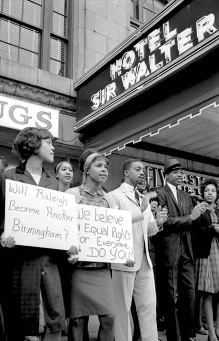 This is an image of African Americans picketing in Raleigh, North Carolina, outside of the Sir Walter Hotel in 1963.