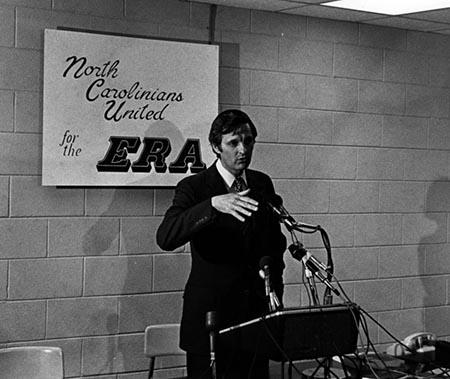 The photo shows Alda at a podium with a sign behind him reading, "North Carolinians United for the ERA."