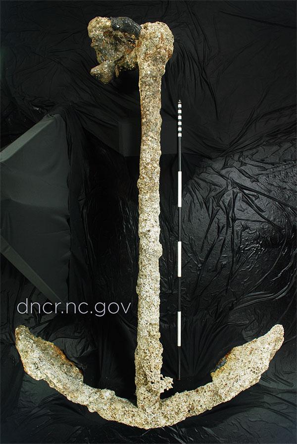 Photograph of Anchor No. 1, recovered by archaeologists from the Queen Anne's Revenge off the coast of North Carolina. The Queen Anne's Revenge (also called the QAR) was the sailing ship of the pirate Edward Teach, also known as Blackbeard.