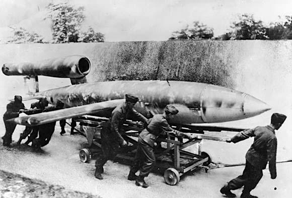Buzz bomb. Men work on the bomb together. Black and white photo.
