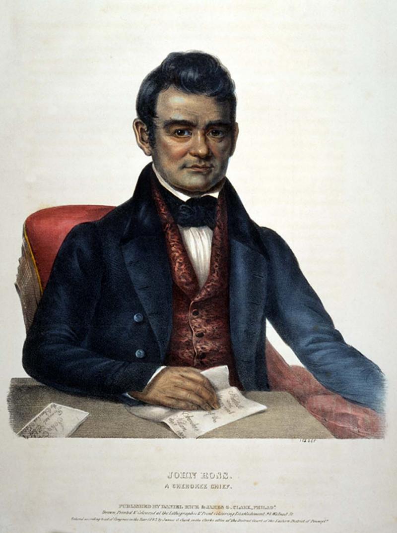Cherokee Chief John Ross. He is seated in a chair, wearing a suit. His hair is coiffed and he has no facial hair.