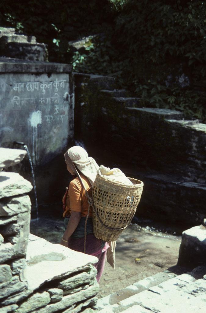 <img typeof="foaf:Image" src="http://statelibrarync.org/learnnc/sites/default/files/images/nepal_056.jpg" width="675" height="1024" alt="Nepali woman at a community water tap" title="Nepali woman at a community water tap" />