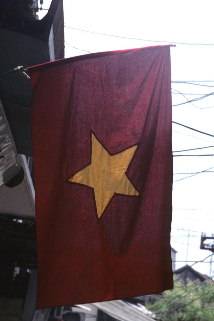 <img typeof="foaf:Image" src="http://statelibrarync.org/learnnc/sites/default/files/images/vietnam_002.jpg" width="683" height="1024" alt="Flag of Socialist Republic of Vietnam hanging in Hanoi" title="Flag of Socialist Republic of Vietnam hanging in Hanoi" />