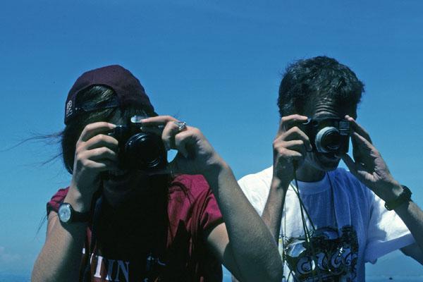 <img typeof="foaf:Image" src="http://statelibrarync.org/learnnc/sites/default/files/images/vietnam_004.jpg" width="600" height="400" alt="Two tourists take photographs near Nha Trang" title="Two tourists take photographs near Nha Trang" />