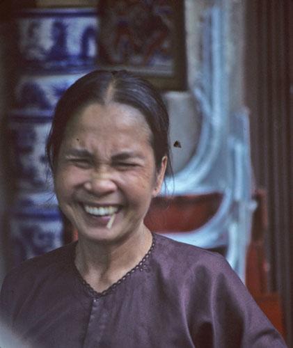 <img typeof="foaf:Image" src="http://statelibrarync.org/learnnc/sites/default/files/images/vietnam_006.jpg" width="421" height="500" alt="Hanoi woman laughing with toothpick in her mouth" title="Hanoi woman laughing with toothpick in her mouth" />