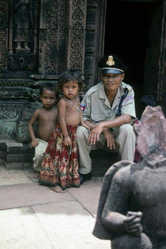 <img typeof="foaf:Image" src="http://statelibrarync.org/learnnc/sites/default/files/images/vietnam_014.jpg" width="333" height="500" alt="Uniformed guard sits with two small children at Banteay Srei Temple" title="Uniformed guard sits with two small children at Banteay Srei Temple" />