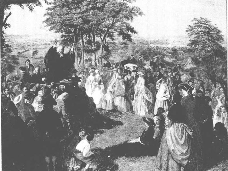 George Whitefield preaching George Whitefield preaching. In this print, White field is standing on a pedestal, waving his arms before a crowd. They are entranced by his sermon.