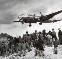 Image of plane and citizens during the Berlin Airlift.