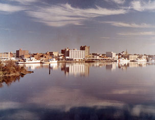 "Wilmington, NC, c.1974, Color Waterfront View of the Business District, view over water." From Carolina Power and Light (CP&L) Photograph Collection (Ph.C.68), North Carolina State Archives; call #: PhC68_1_77. 