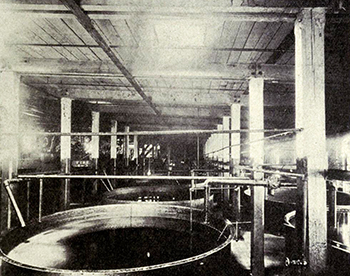 Interior view of a large cotton oil refinery, circa 1911. Image from Archive.org.