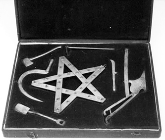 Box of six symbolic miniature tools and a star, used in Grange ceremonies. Image from the North Carolina Museum of History.