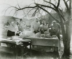 Mary Martin and Eustace Sloop Operating Under an Apple Tree. Image courtesy of the Crossnore School via DigitalNC.