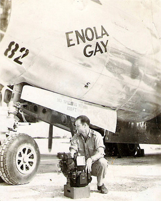 Thomas Ferebee beside the Enola Gay