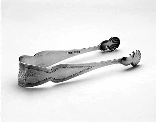 Photograph of sterling silver sugar tongs made by John Volger circa 1810 to 1825.  From the collections of the North Carolina Museum of History. 