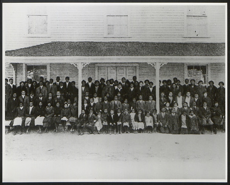 Group photograph of students and employees of Palmer Institute in front of Memorial Hall.