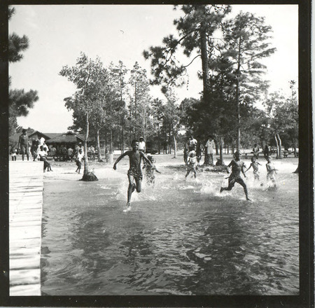Children racing into the water at Jones Lake State Park beach area, circa 1963.