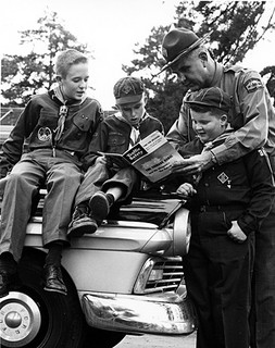 Unidentified NC Highway Patrol personnel, c.1960, with Boy Scouts and Cub Scout. From NC Department of Conservation and Development, Travel and Tourism photo files, North Carolina State Archives, Raleigh, NC, call #:  ConDev_TID_367_2. 