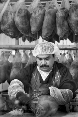 Processing country ham at a plant in Smithfield. Photograph by Corey Lowenstein. Raleigh News and Observer.