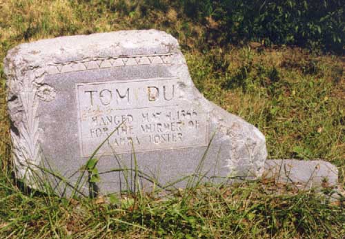Tom Dula's headstone. It is eroded and broken.