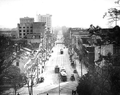 "Elevated view of Fayetteville St.reet, raleigh, NC, looking south showing the main business district, 1913." From Carolina Power and Light (CP&L) Photograph Collection (Ph.C.68), North Carolina State Archives; call #: PhC68_1_90.