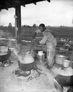 Fish stews are usually cooked outside in a cast-iron pot. Image courtesy of Conservation and Development Department, Travel and Tourism Photo Files, North Carolina State Archives, call #: ConDev4650.5B, Raleigh, NC.