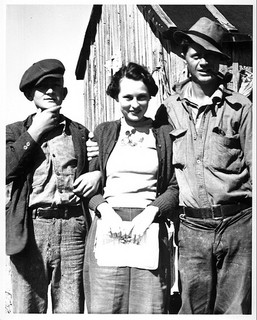 Gillikin Island, Onslow County, NC, ca. 1939. The fish camp at Brown's Inlet (Onslow County) can be reached by power boat or an arduous struggle with oars. Yet most Sundays the girls arrive. Every fisherman on the island wanted his picture made with this charming lass. Caption and photograph by Charles A. Farrell. From the Charles A. Farrell Photograph Collection, North Carolina State Archives, call #:  PhC9_2_3_15, Raleigh, NC.