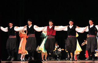 Dancers from Greece performing on stage, Folkmoot, 2009. Image courtesy of Flickr user anoldent.