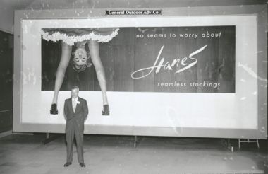 "Gordon Hanes, of Hanes Corporation, in front of a Hanes Hosiery billboard, 1956." Image courtesy of DigitalForsyth. 