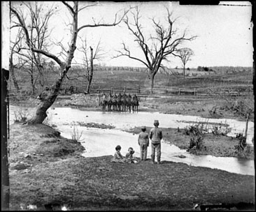 Children watching soldiers at Sudley Ford, Virginia in what would become the Battle of Bull Run.  Photograph, March 1862 by George Barnard.  From the Civil War Glass Negatives Collection, Library of Congress. 