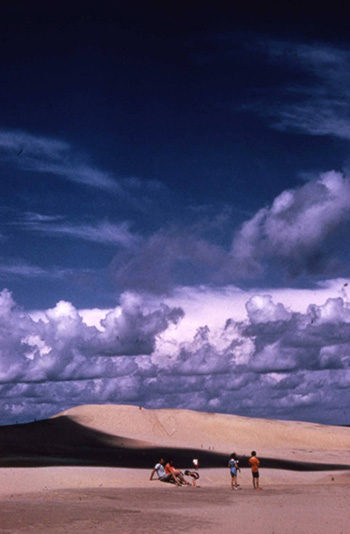 Visitors on sand dunes, Jockey's Ridge State Park.  North Carolina State Parks Collection, North Carolina Digital Collections. Prior permission from the North Carolina Division of State Parks is required for any commercial use.