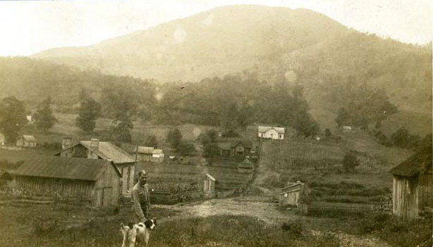 This photo shows a small farming community in Ashe County, N.C. taken about 1920. The photo comes from the collection of the N.C. Museum of History.